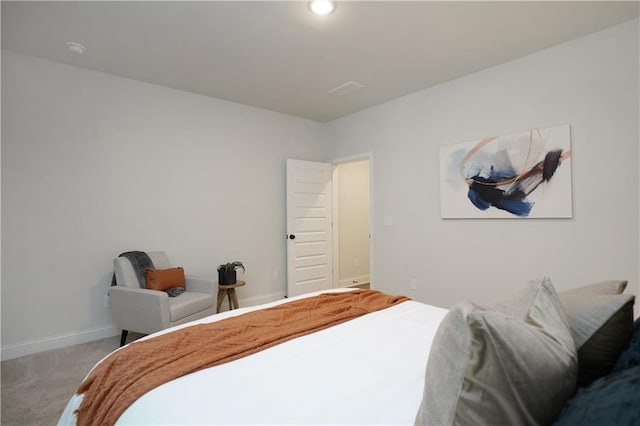 carpeted bedroom featuring baseboards