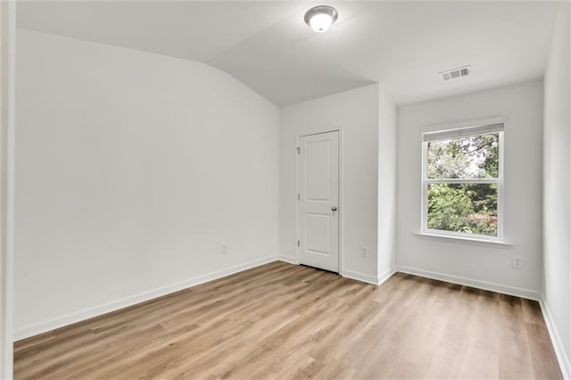 5312 Brooklands Dr, Lithonia, GA 30058 - unfurnished room with light wood-style flooring and vaulted ceiling