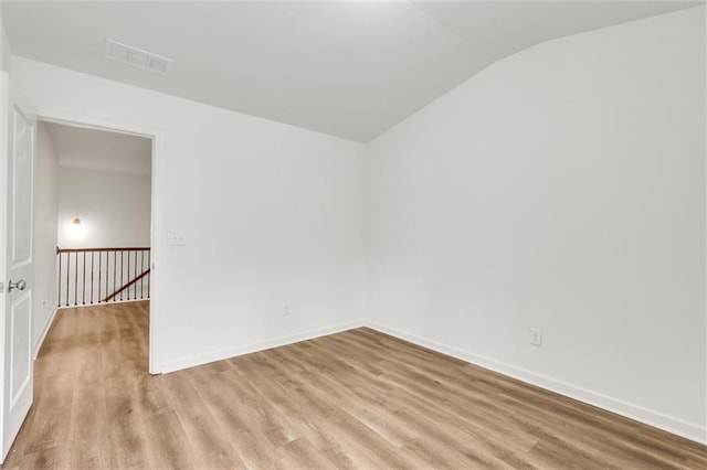 5312 Brooklands Dr, Lithonia, GA 30058 - unfurnished room with lofted ceiling and light wood-style floors
