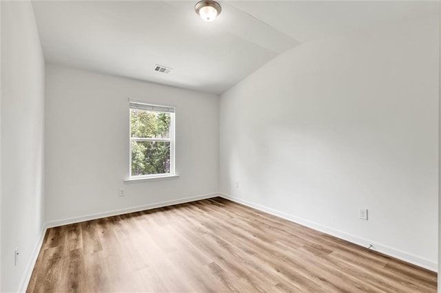 5312 Brooklands Dr, Lithonia, GA 30058 - spare room featuring light wood-type flooring and lofted ceiling