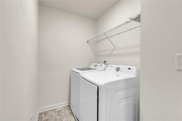 5312 Brooklands Dr, Lithonia, GA 30058 - washroom with washer and clothes dryer and baseboards