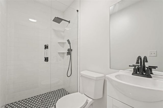 bathroom featuring vanity, toilet, and walk in shower