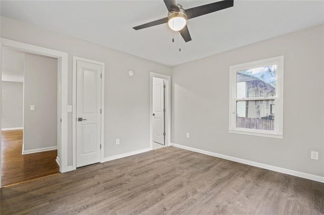 unfurnished bedroom with wood-type flooring and ceiling fan