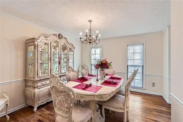 dining area with an inviting chandelier, baseboards, dark wood-style flooring, and ornamental molding