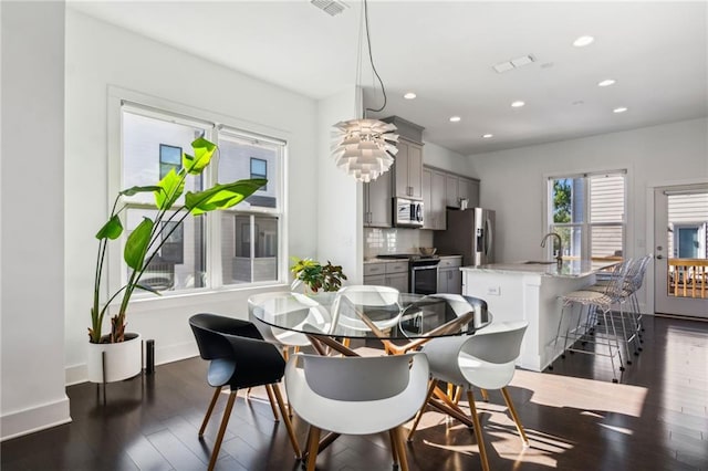 2034 Rockledge Rd NE, Atlanta, GA 30324 - dining space featuring recessed lighting, dark wood-type flooring, and baseboards