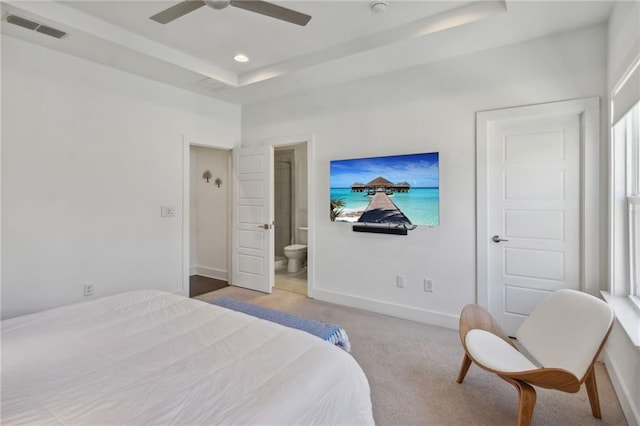 2034 Rockledge Rd NE, Atlanta, GA 30324 - carpeted bedroom featuring a tray ceiling, ensuite bathroom, baseboards, and a ceiling fan