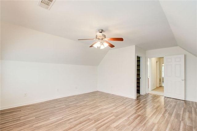 additional living space with ceiling fan, light hardwood / wood-style flooring, and lofted ceiling