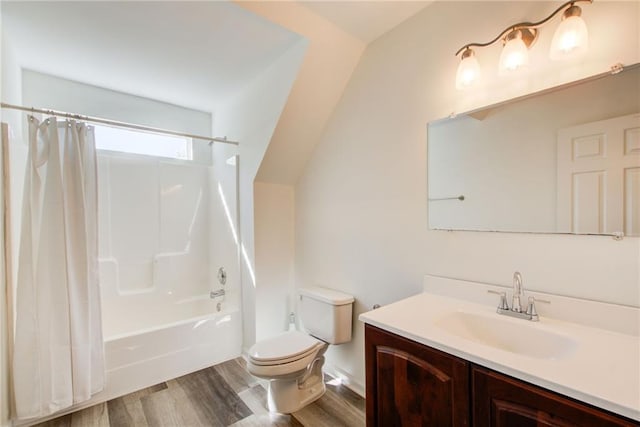 full bathroom featuring hardwood / wood-style floors, shower / bath combo, toilet, and vanity