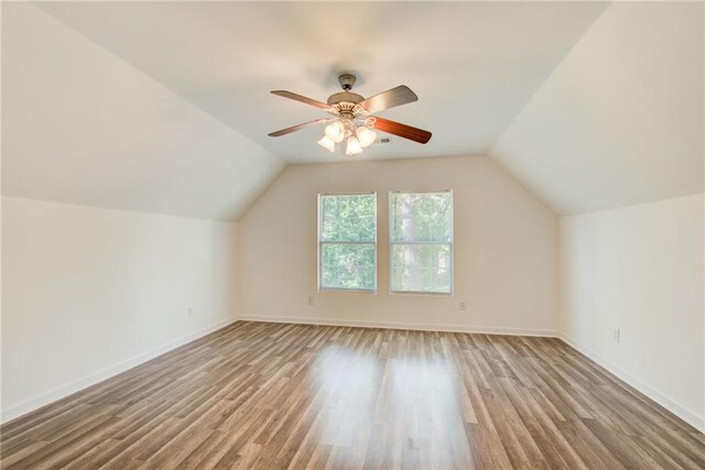 bonus room featuring ceiling fan, lofted ceiling, and light hardwood / wood-style flooring