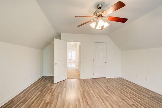 bonus room with ceiling fan, light hardwood / wood-style floors, and lofted ceiling