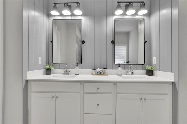 bathroom with double vanity and a sink