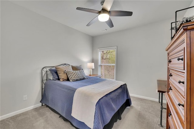 bedroom featuring light carpet, baseboards, and visible vents