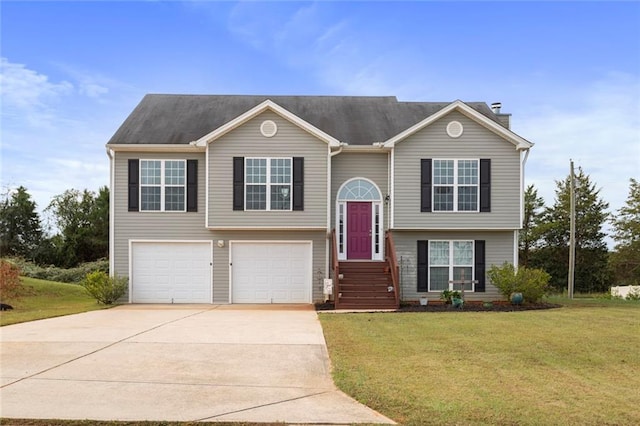 split foyer home with a garage and a front yard