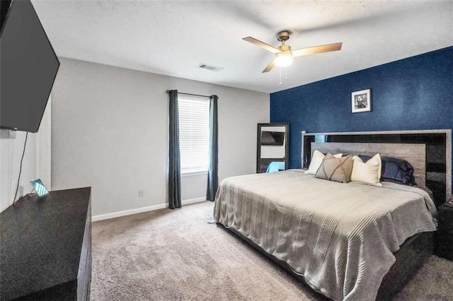 bedroom featuring a ceiling fan, carpet, visible vents, and baseboards