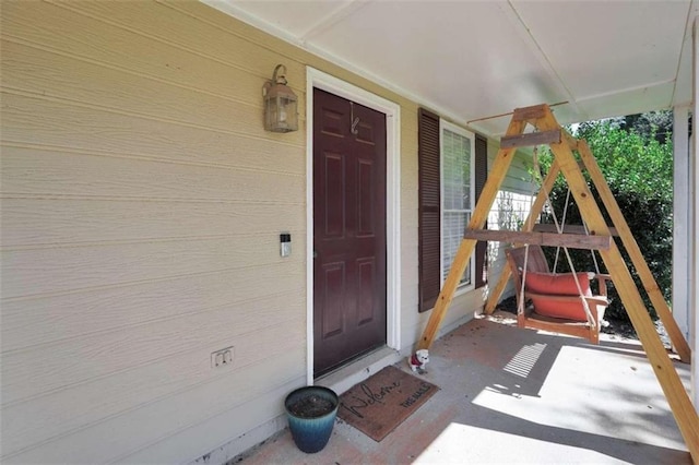 doorway to property featuring a porch