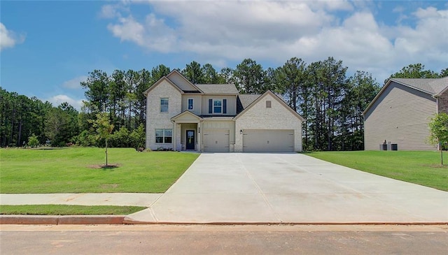 view of front of property with a garage and a front yard