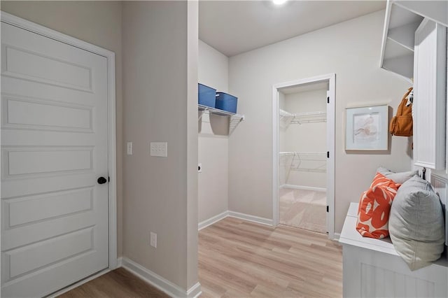 mudroom with light hardwood / wood-style flooring