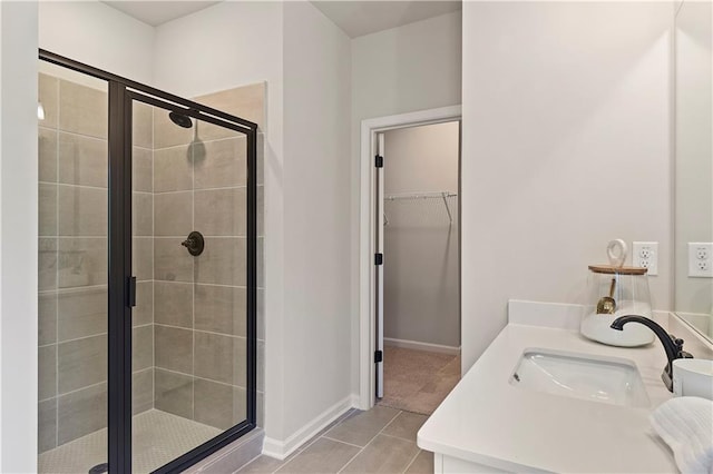 bathroom with vanity, tile patterned floors, and walk in shower