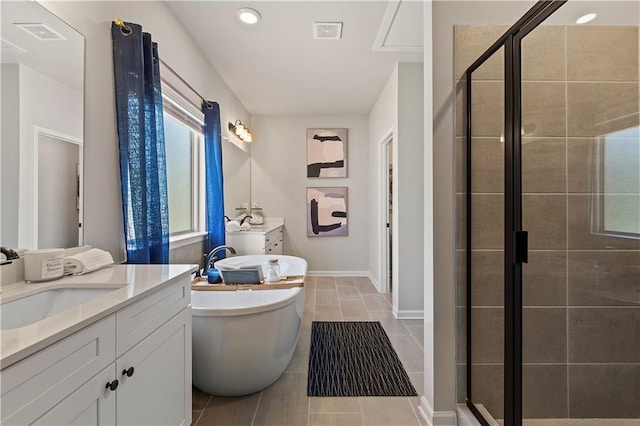 bathroom with vanity, tile patterned floors, and separate shower and tub