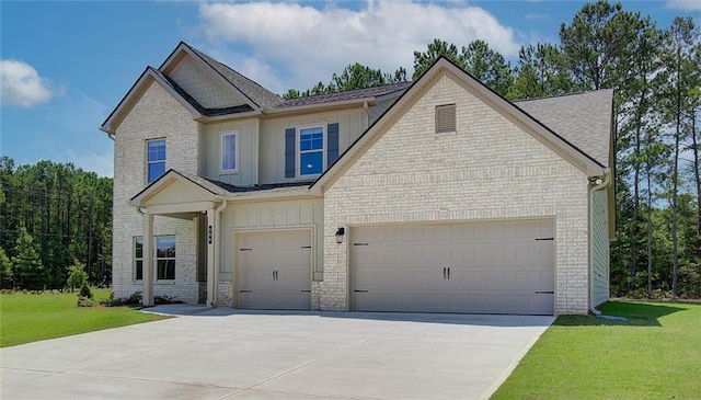 craftsman-style home with a garage and a front lawn