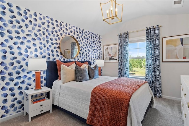 carpeted bedroom featuring vaulted ceiling and a chandelier