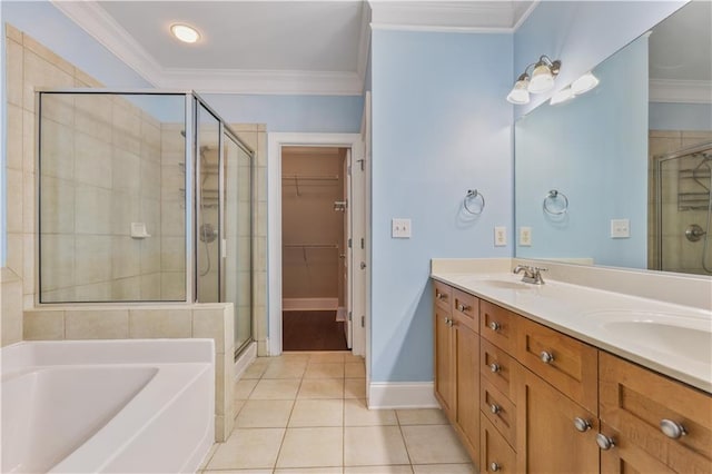 bathroom featuring a sink, a stall shower, tile patterned flooring, and crown molding