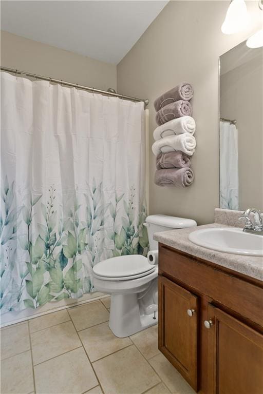 bathroom featuring tile patterned floors, curtained shower, toilet, and vanity