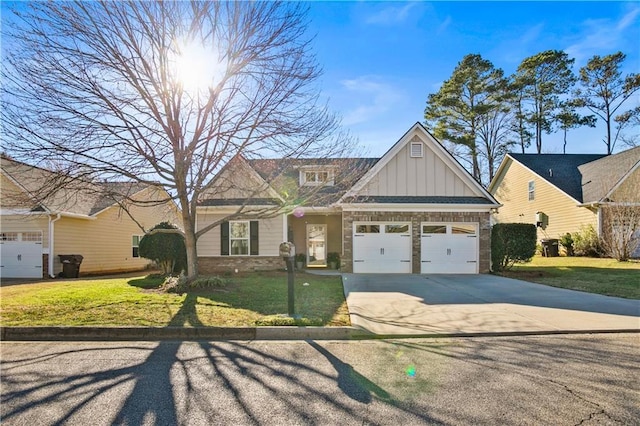 craftsman-style house featuring a front yard, a garage, board and batten siding, and concrete driveway