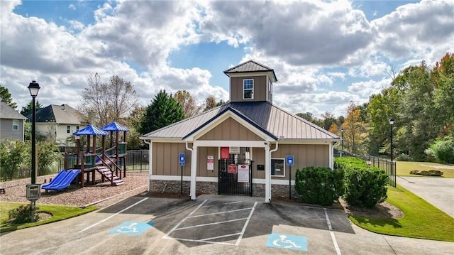 view of building exterior with fence