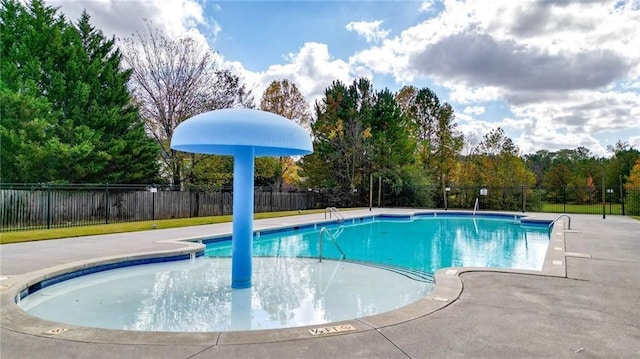 pool with fence and a patio area