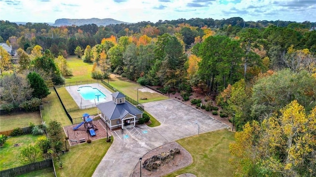 drone / aerial view featuring a forest view