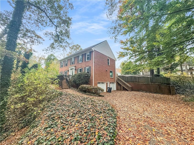 view of property exterior with a garage