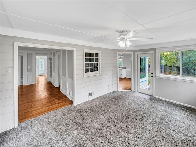 interior space with hardwood / wood-style floors, a wealth of natural light, and ceiling fan