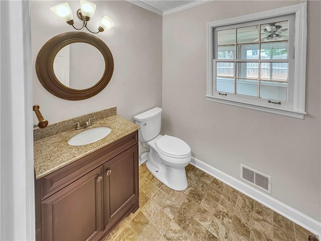 bathroom featuring toilet, vanity, a notable chandelier, and ornamental molding