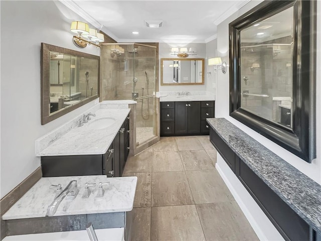 bathroom with tile patterned floors, crown molding, a shower with door, and vanity