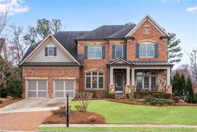 craftsman inspired home featuring brick siding, a front lawn, concrete driveway, metal roof, and a standing seam roof