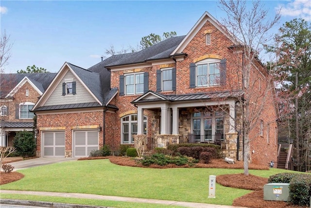 view of front of home with brick siding, a front lawn, metal roof, driveway, and a standing seam roof