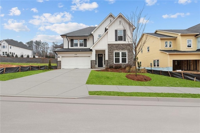 view of front facade with a garage and a front yard