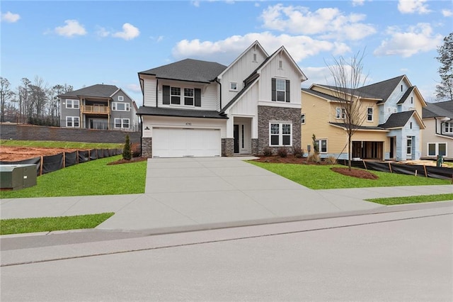 view of front of home featuring a garage and a front lawn