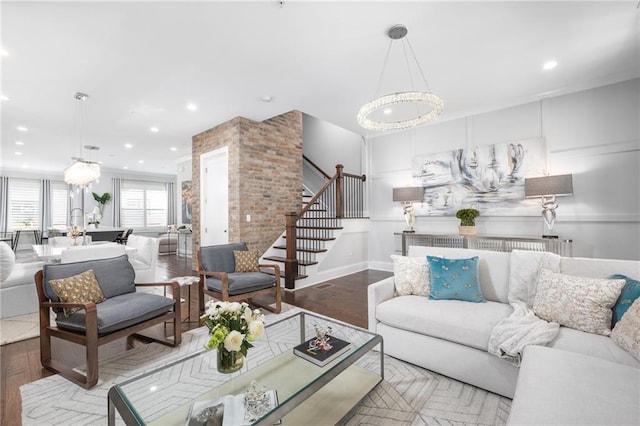 410 Concord St, Alpharetta, GA 30009 - living room featuring wood finished floors, stairs, recessed lighting, and a chandelier
