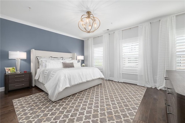 410 Concord St, Alpharetta, GA 30009 - bedroom featuring wood finished floors, a chandelier, baseboards, and crown molding