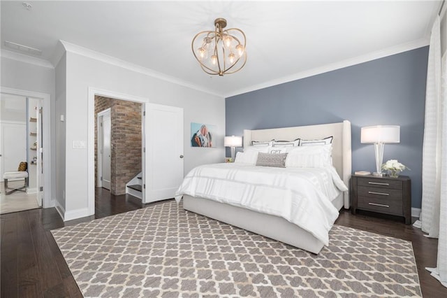 410 Concord St, Alpharetta, GA 30009 - bedroom with crown molding, a chandelier, wood finished floors, and baseboards