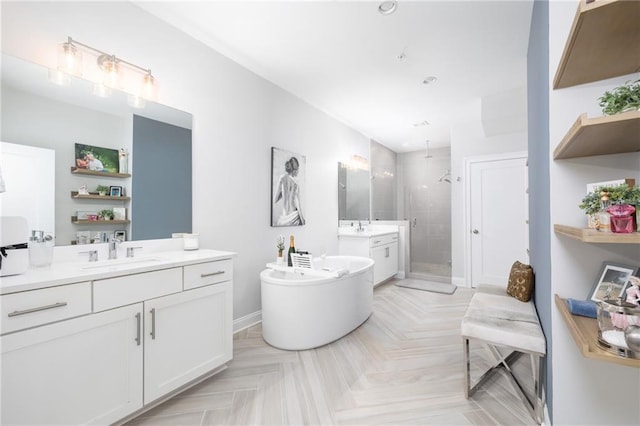 410 Concord St, Alpharetta, GA 30009 - bathroom featuring a shower stall, two vanities, a soaking tub, baseboards, and recessed lighting