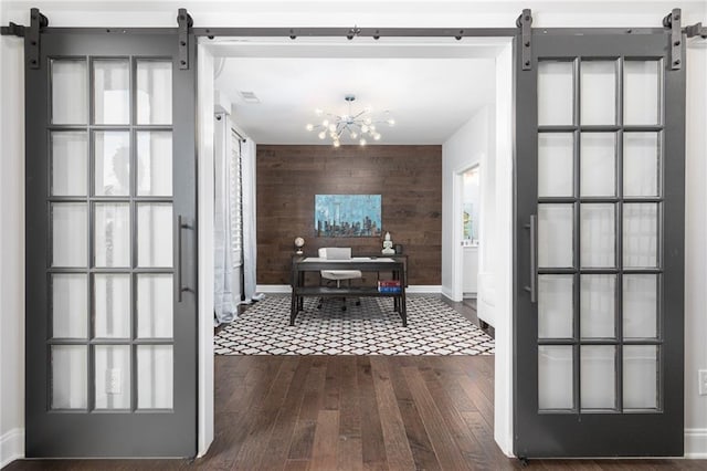 410 Concord St, Alpharetta, GA 30009 - dining area with a barn door, wooden walls, baseboards, dark wood-type flooring, and a desk