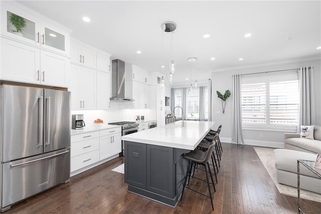 410 Concord St, Alpharetta, GA 30009 - kitchen with stainless steel appliances, wall chimney range hood, healthy amount of natural light, light countertops, and recessed lighting