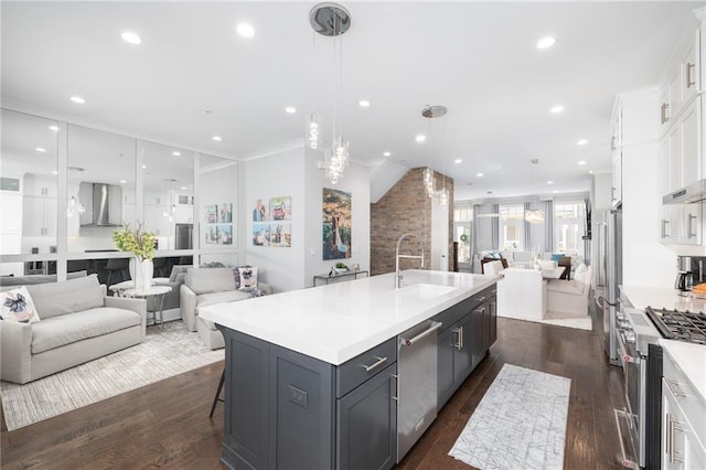 410 Concord St, Alpharetta, GA 30009 - kitchen with open floor plan, a sink, stainless steel appliances, wall chimney range hood, and white cabinetry