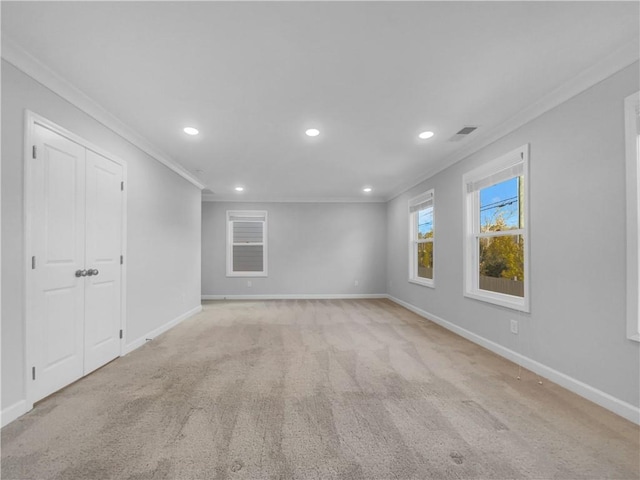 unfurnished room featuring visible vents, crown molding, baseboards, light carpet, and recessed lighting