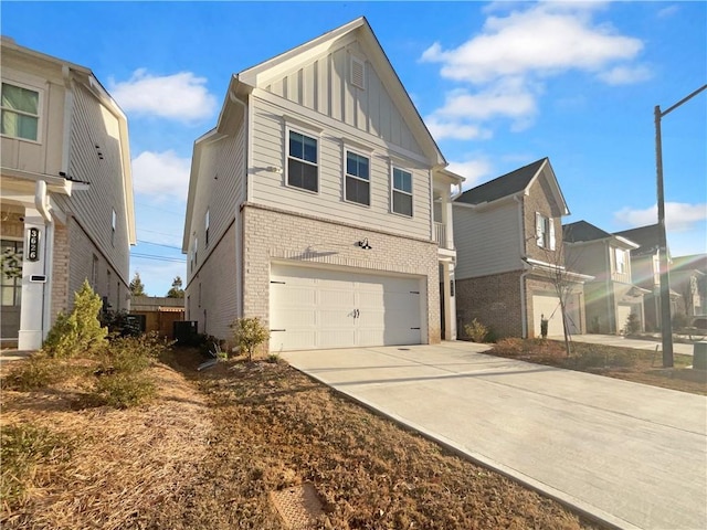 exterior space with brick siding, board and batten siding, driveway, and a garage