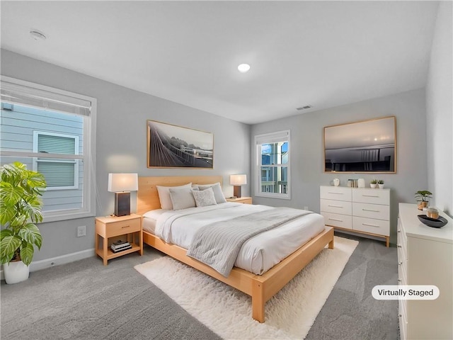 bedroom featuring visible vents, recessed lighting, baseboards, and carpet