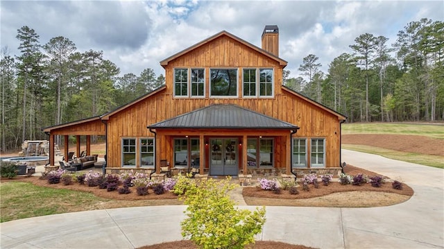 view of front of home with french doors and a jacuzzi